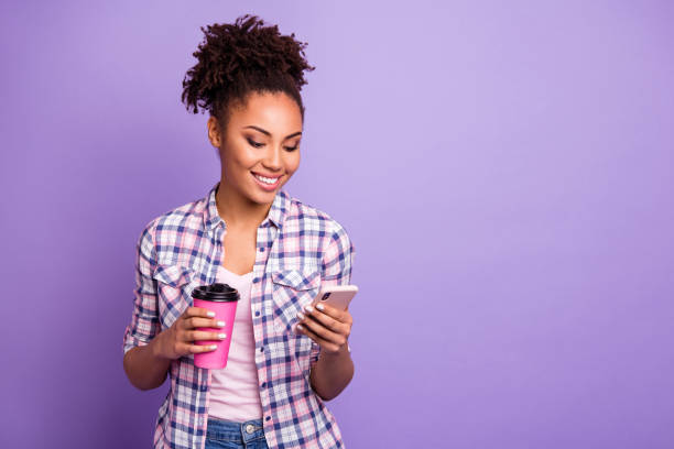 istock Portrait focused interested student hipster beautiful chill use user device gadget read news feed communicate video call casual checked stylish trendy shirt top-knot bun isolated purple background 1157099184