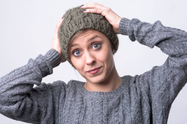 istock Oops. Mistake concept. Expressive young woman looking at camera with hands on head 1157099269