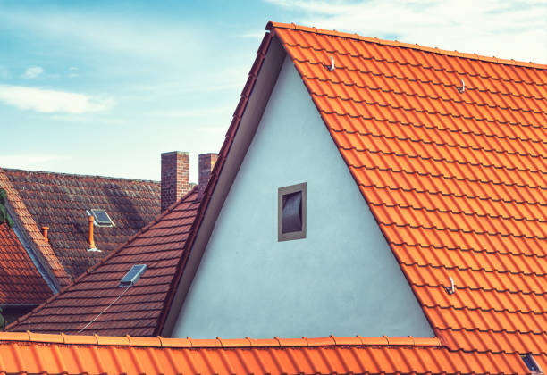 istock Modern European rooftops with tiles and chimneys 1157100853