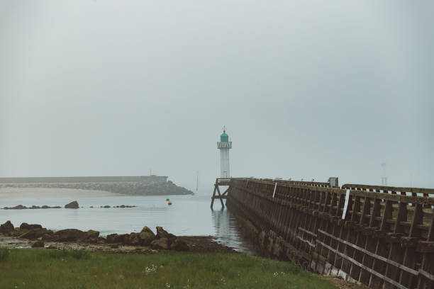 istock Pier and lighthouse in the harbour 1157101062