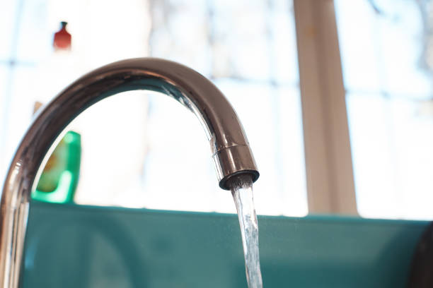 istock Water running from kitchen sink faucet 1157101741
