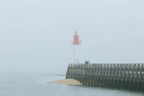 istock Pier and lighthouse in the harbour 1157101797