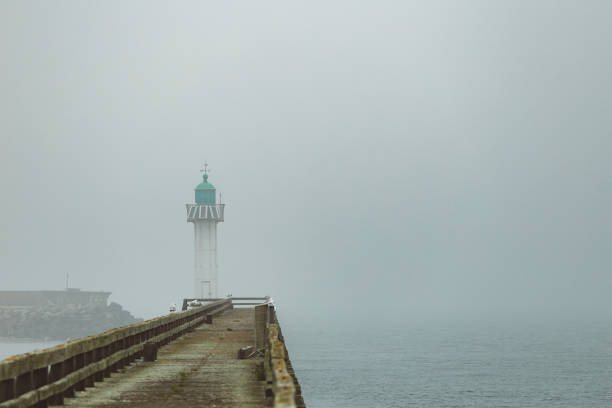istock Pier and lighthouse in the harbour 1157102333