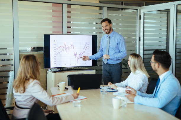istock Businessman leading presentation in meeting room 1157103849