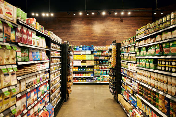 All your necessities stored in one place Shot of fully stocked isles in a grocery store during the day organic food stock pictures, royalty-free photos & images