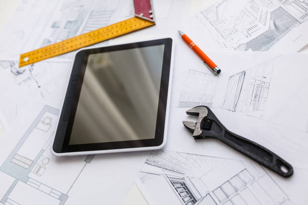 istock Computer Tablet with Master Bathroom Design Over House Plans, Pencil and Compass 1157106753