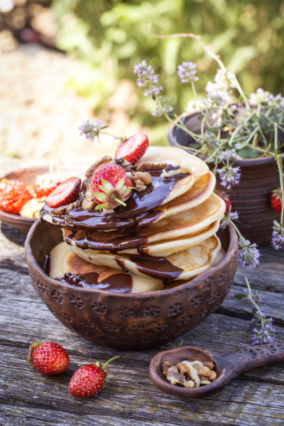 istock pancakes with chocolate and fresh strawberries in a rustic style 1157106885