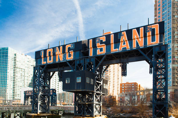 Long Island Sign Queens NYC Historic Long Island sign seen from Gantry State Park in Long Island City, Queens New York east river new york city photos stock pictures, royalty-free photos & images