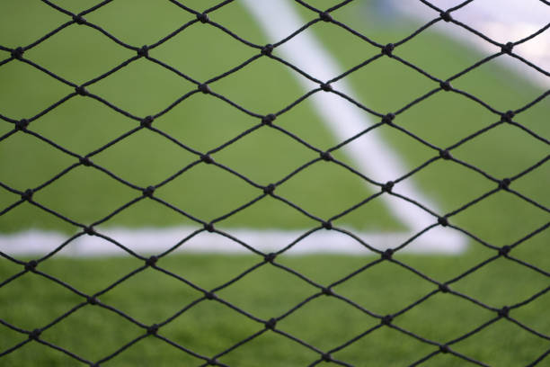 istock A net with football artificial turf in the background. 1157108806