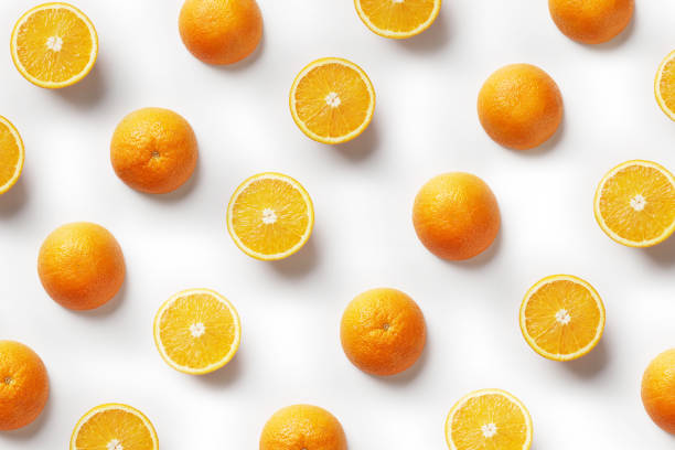 istock Tropical abstract background. Orange fruit on the white background 1157109910