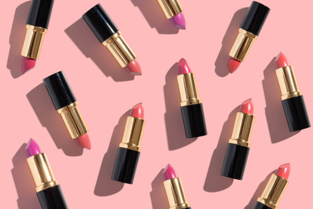 istock Set of color lipsticks on pink background. Flat lay. 1157110931