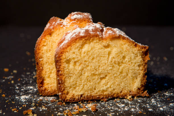 istock Homemade lemon cake on dark background, close up 1157111417