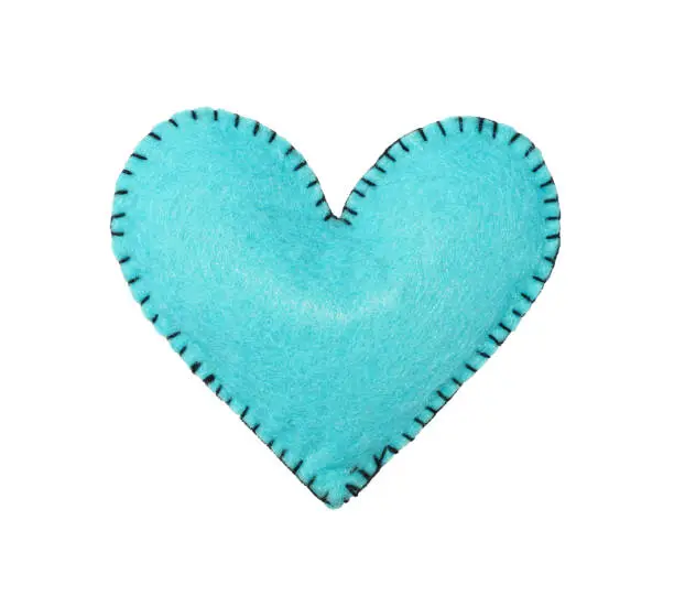 Photo of One blue felt stitched heart isolated on white