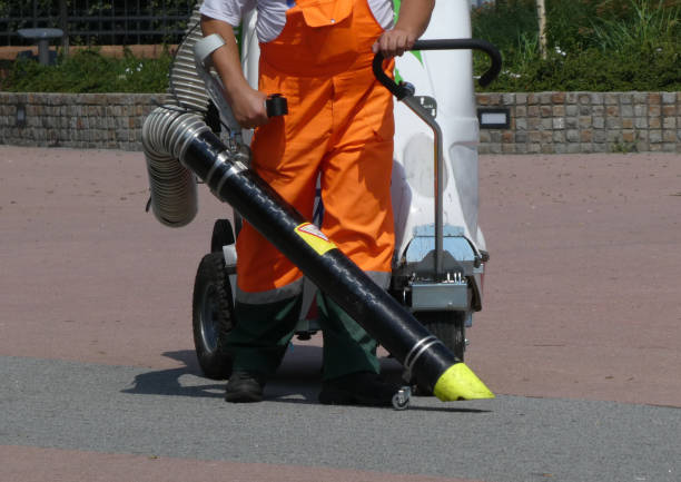 istock Man cleaning the street  using cleaning machine 1157117720