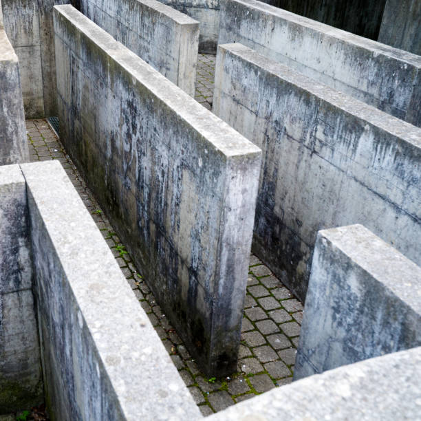 modern labyrinth made out of concrete on a playground detail view Horizontal detailed view of a modern labyrinth made out of concrete on a playground bulle stock pictures, royalty-free photos & images