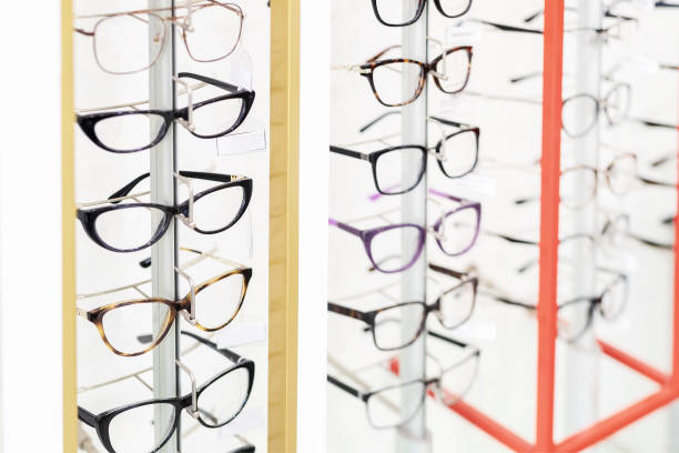 istock Many glasses rows at optical retail store. Rich assortment choice of different eyewear frames on eyeglasses shop display 1157121168
