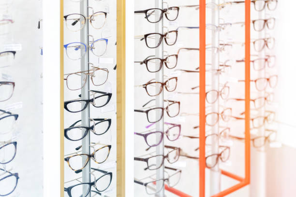 istock Many glasses rows at optical retail store. Rich assortment choice of different eyewear frames on eyeglasses shop display 1157121172