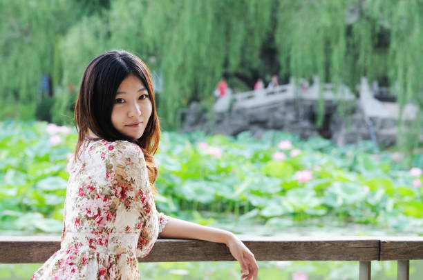 Young girl and blooming lotus