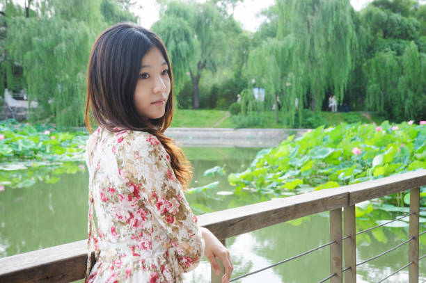 Young girl and blooming lotus