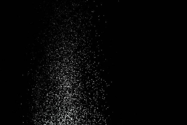 istock Flour sifting on a black background. White powder splash isolated on black. Explosive powder white 1157123231