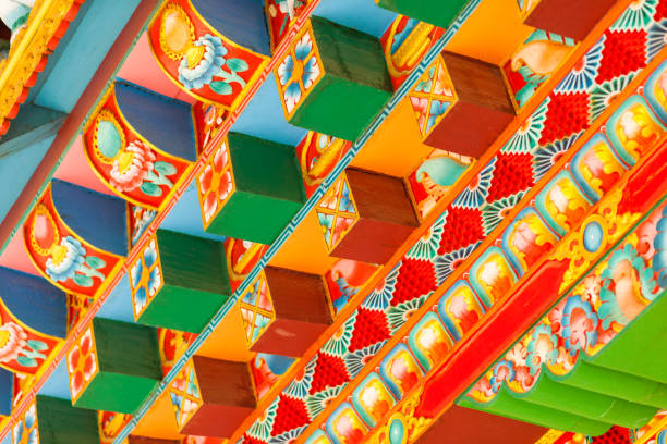 Buddhist temple details Brightly painted details at the Drigung Kagyud Lotus Stupa (German Temple), Lumbini, Nepal lumbini nepal photos stock pictures, royalty-free photos & images