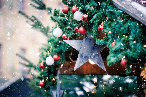 magical christmas market: decoration with christmas bauble on a fir branch. - fir branch imagens e fotografias de stock