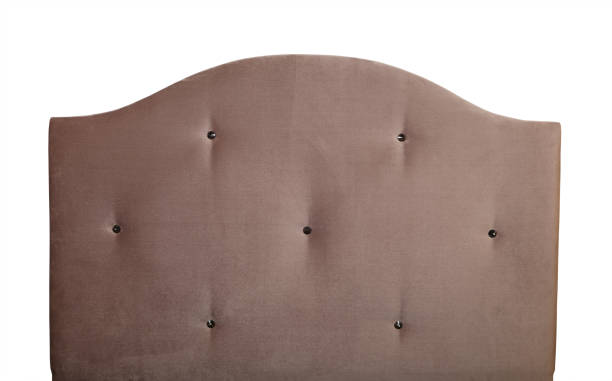 istock Beige soft velvet bed headboard isolated on white 1157124388