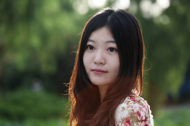 istock Young girl and blooming lotus 1157124934