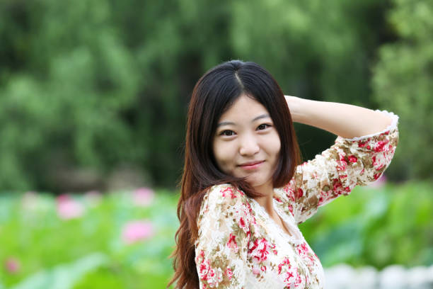 Young girl and blooming lotus