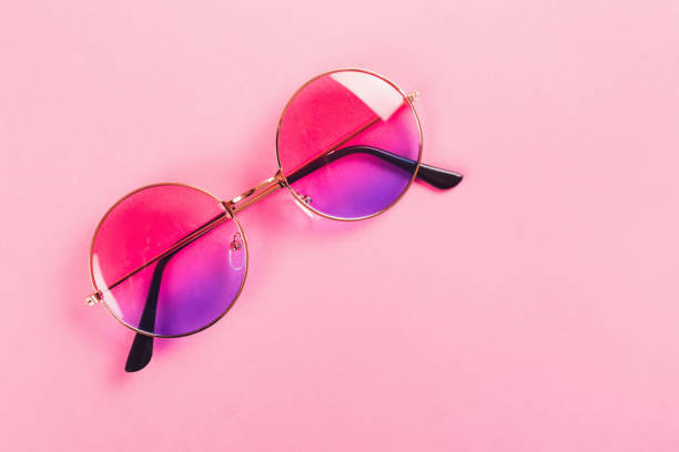istock Round summer duotone sunglasses on pink background. 1157128197
