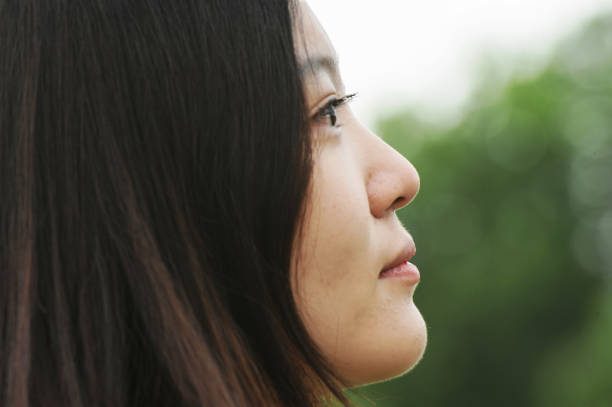istock Young girl and blooming lotus 1157128602
