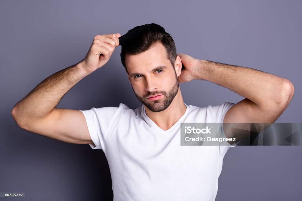 Close Up Photo Amazing He Him His Macho Perfect Appearance Hands Arms  Plastic Hair Styling Brush Take Care Hairdo After Barber Shop Stylist Visit  Wear Casual White Tshirt Isolated Grey Background Stock