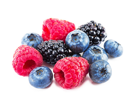 Fresh ripe berry on a white background. Blueberry, raspberry and blackberry isolated.