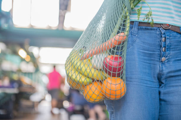 istock Fruits and Vegetables in a cotton mesh reusable bag, Zero Waste Shopping concept 1157131708