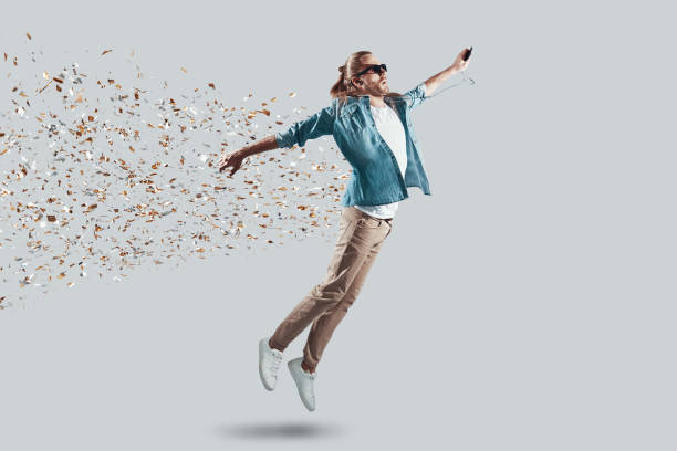 istock Wow! Full length of handsome young man making a face while hovering against grey background 1157132009