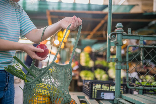 istock Fruits and Vegetables in a cotton mesh reusable bag, Zero Waste Shopping on Outdoors Market 1157132017