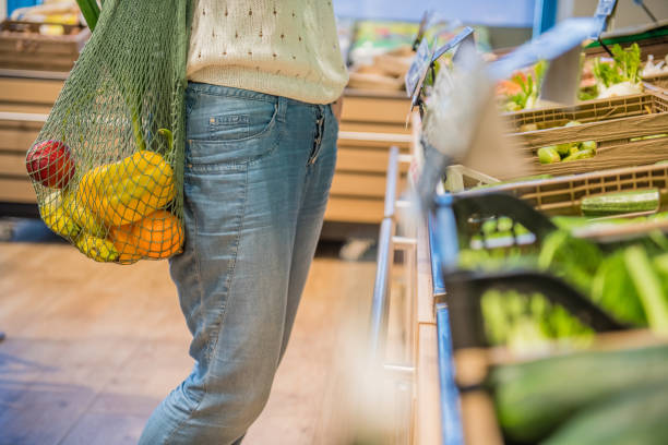 istock Fruits and Vegetables in a cotton mesh reusable bag, Zero Waste Shopping Close Up 1157133094
