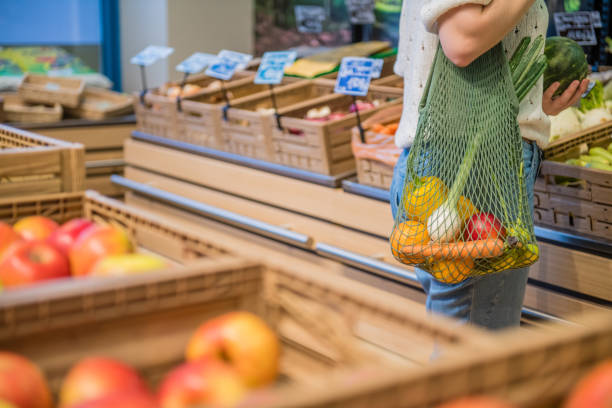 istock Fruits and Vegetables in a cotton mesh reusable bag, Zero Waste Shopping Close Up 1157133255
