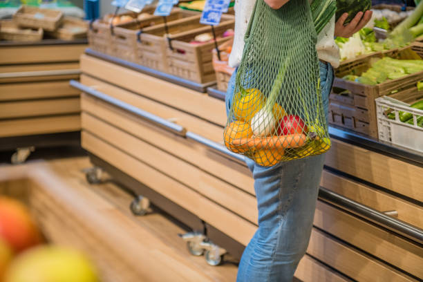 istock Fruits and Vegetables in a cotton mesh reusable bag, Zero Waste Shopping Close Up 1157133272