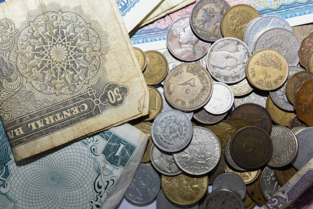 istock old paper banknote and metal coins 1157134726