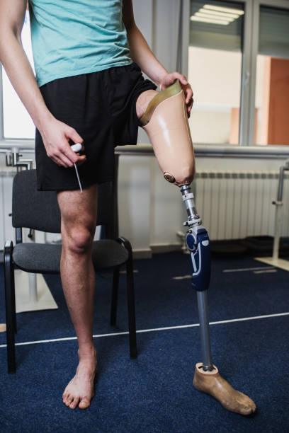 istock Disabled man at physiotherapy center 1157136370