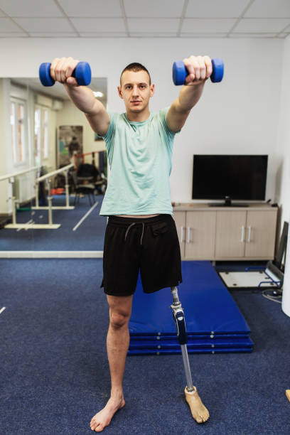 istock Disabled man at physiotherapy center 1157136473