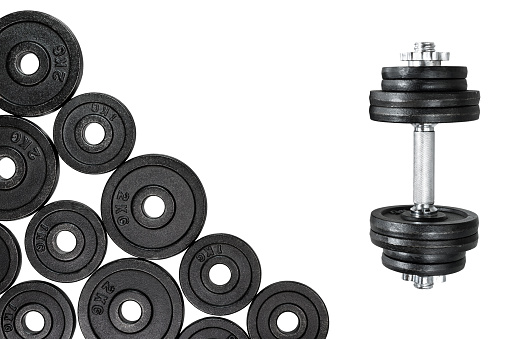 Gym dumbbells with black metal weights 1kg and 2kg, isolated on white background with clipping path. Top view, flat lay. Can be used as a gym background.