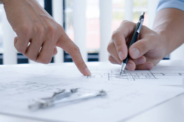 istock Colleagues interior designer Corporate Achievement Planning Design on blueprint Teamwork Concept with compasse. 1157139211