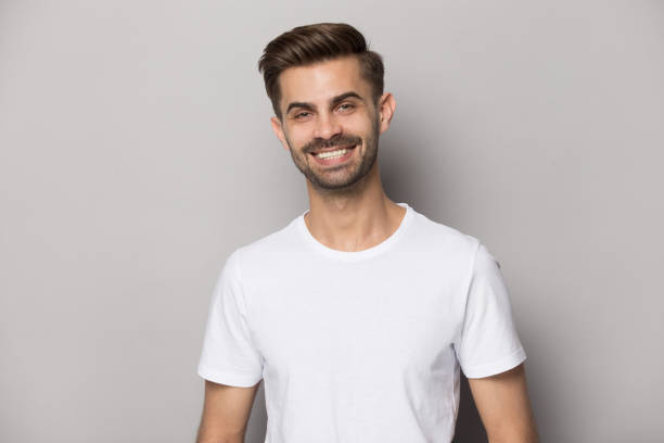 istock Attractive positive guy with snow-white smile looking at camera 1157139840
