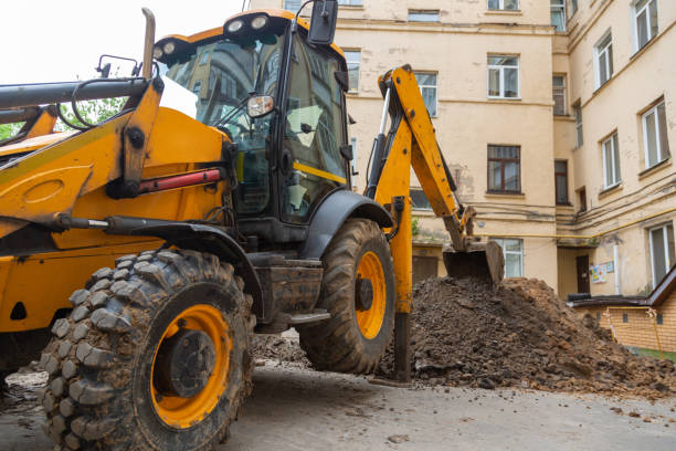istock The excavator digs a trench for repair work on the heating main. 1157141149