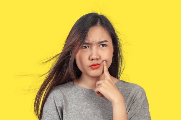 istock young woman in action thinking or get some idea . 1157141186