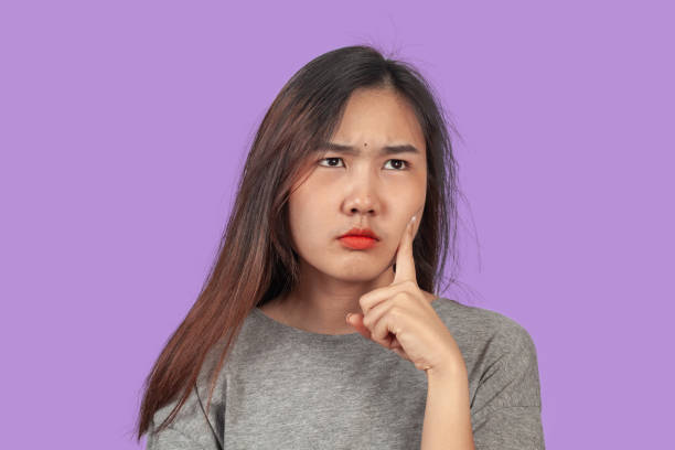 istock young woman in action thinking or get some idea . 1157141199