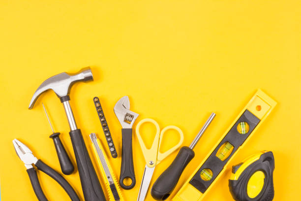 istock Set of various construction tools. Tools for home repair. Work at a construction site. On a yellow background. Flatlay. 1157142340