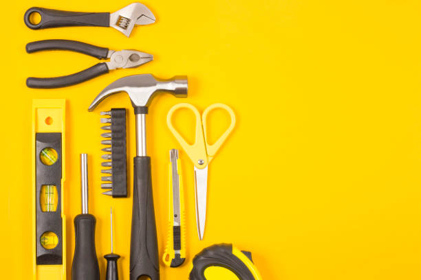 istock Set of various construction tools. Tools for home repair. Work at a construction site. On a yellow background. Flatlay. 1157142473